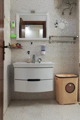 a bathroom with a sink and a mirror at Golden Home Hurghada El Kauser in Hurghada