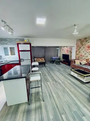 a room with a kitchen and a living room at El Hambra compound in Hurghada