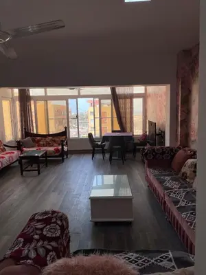 a living room with couches and a table at El Hambra compound in Hurghada