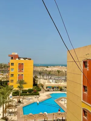 a view of a pool from a building at El Hambra compound in Hurghada