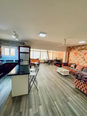 a large living room with a kitchen and a living room at El Hambra compound in Hurghada