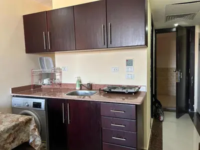 a kitchen with a sink and a counter top at Sea view chalet in Sahl Hasheesh
