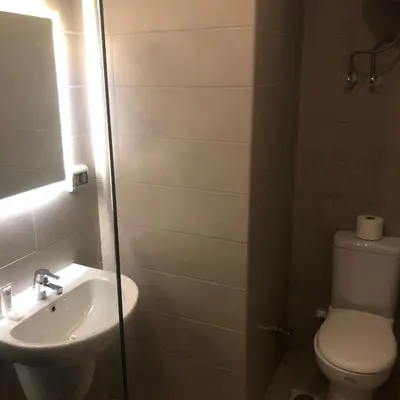 a bathroom with a toilet and a sink at Cozy Studio in Hurghada