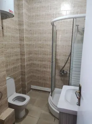 a bathroom with a shower and a toilet and a sink at Hurghada in Hurghada