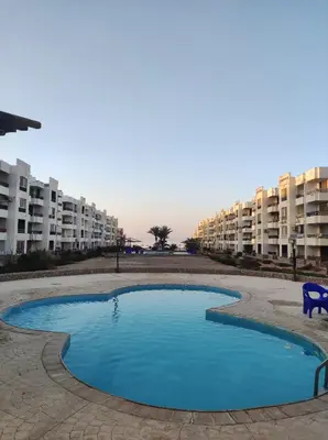 a small pool in the middle of an apartment complex at Hurghada in Hurghada