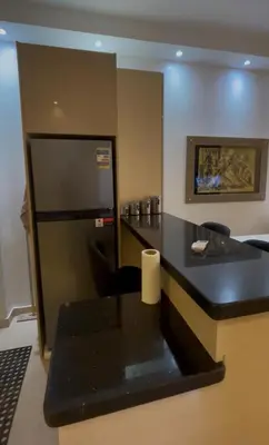 a kitchen with a black counter top in a room at apartment for rent in hurghada in Hurghada