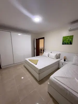 a bedroom with two beds at TiBa Golden Resort in Hurghada