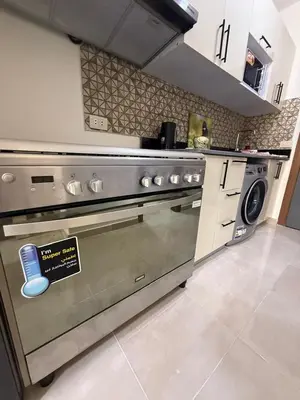 a kitchen with an oven with a sign on it at TiBa Golden Resort in Hurghada