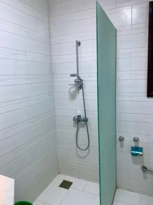 a shower with a glass door in a bathroom at Turtles Beach Resort - Hurghada in Hurghada