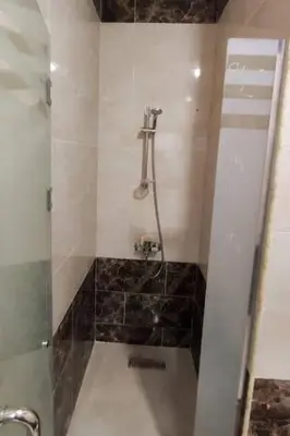 a shower in a bathroom with a glass door at LA PRESTIGIa in Hurghada