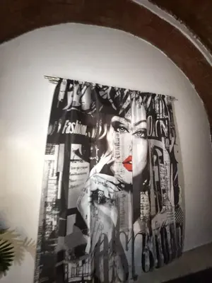 a painting of a woman on a wall at Salem & Renča Guest House in Luxor