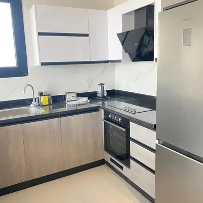a kitchen with a sink and a stove at Jade 18 A in Hurghada