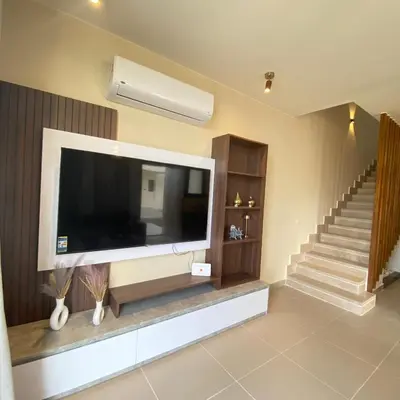 a living room with a large flat screen tv at Jade 18 A in Hurghada