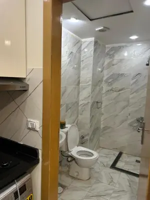 a bathroom with a toilet in a room at شالية فى قرية ميراج باى الغردقة in Hurghada