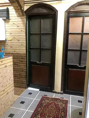 a door to a room with a rug on the floor at Hamada guest house in Aswan