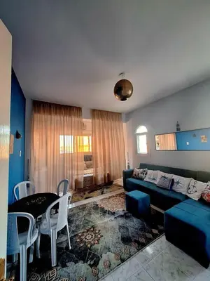 a living room with a couch and a table at Orientalna Willa in Hurghada