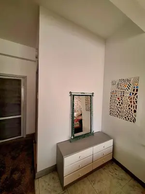 a dressing room with a mirror and a dresser at Orientalna Willa in Hurghada