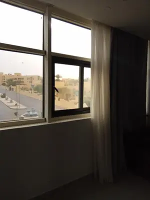 a room with a window with a view of a street at Scandic Resort Hurghada in Hurghada