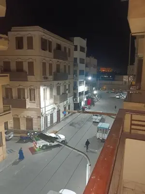 a view of a city street at night at شقه للايجار in Luxor