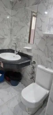 a bathroom with a white toilet and a sink at فندق ميراج باي in Hurghada