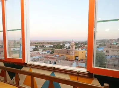 a view of a city from a window at Ekadolli Nubian house- by kerma hospitality in Aswan