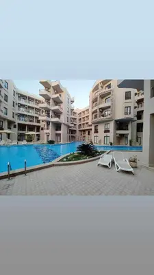 a view of an apartment complex with a swimming pool at Pohodové bydlení v Hurghade in Hurghada