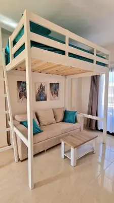 a living room with a bunk bed and a couch at Pohodové bydlení v Hurghade in Hurghada