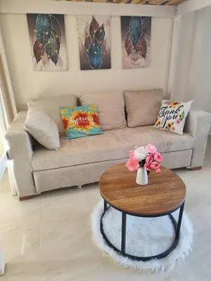 a living room with a couch and a coffee table at Pohodové bydlení v Hurghade in Hurghada