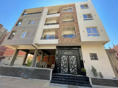 a building with a door in front of it at Endless Summer Apartment House W3 in Hurghada