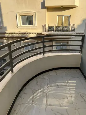 a balcony with a railing on a building at شقة خلف فندق الإليزي in Hurghada