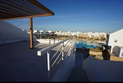 a view of a swimming pool on a roof at Spacious Penthouse in Hurghada