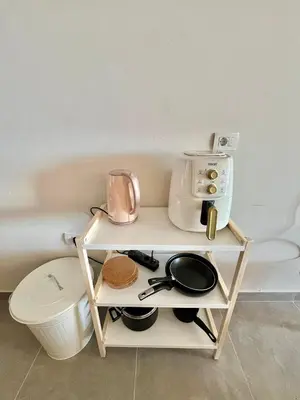 a small table with a coffee maker and a microwave at Villa with pool Miska Soma Bay in Hurghada
