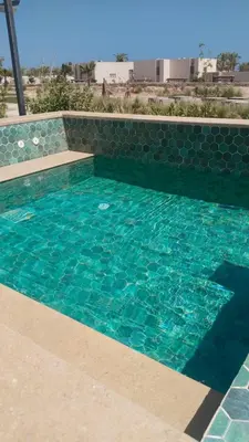 a swimming pool with turquoise blue water at Villa with pool Miska Soma Bay in Hurghada