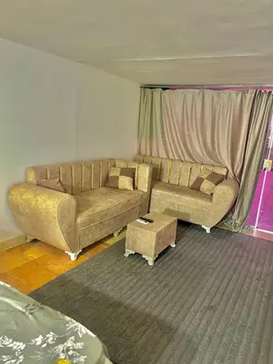 a living room with a couch and a table at Lotus Compound in the Inter Area in Hurghada
