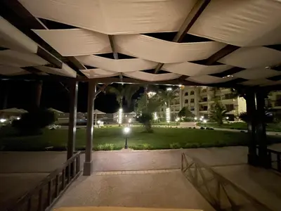 a lit up underside of a pavilion at night at 1BR Relaxing Seaside Retrear Shal Hasheesh in Hurghada