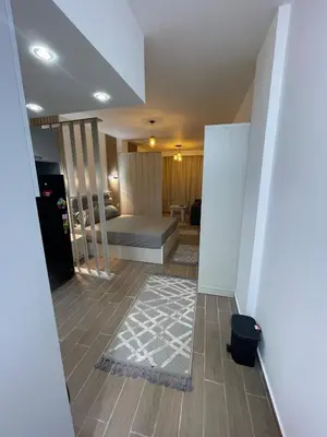 a bedroom with a bed and a rug on the floor at 1BR Relaxing Seaside Retrear Shal Hasheesh in Hurghada