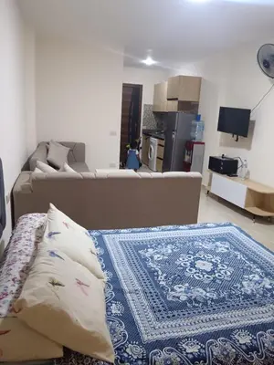 a living room with a couch and a table at استوديو في ذهبية طيبة جولدن الغردقة in Hurghada