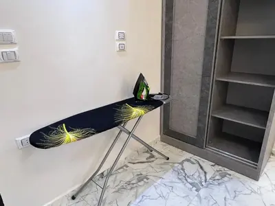 a table with a laptop on it in a room at Hub resort Aqua park in Hurghada