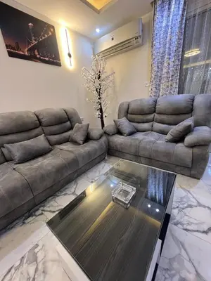 a living room with a couch and a coffee table at Hub resort Aqua park in Hurghada