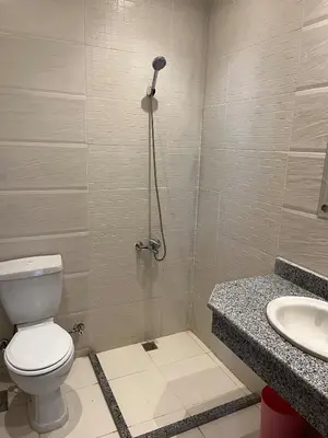 a bathroom with a toilet and a sink at Dream Chalet In Mirage Bay Resort in Hurghada