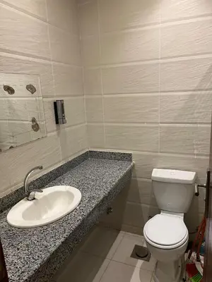 a bathroom with a toilet and a sink at Dream Chalet In Mirage Bay Resort in Hurghada