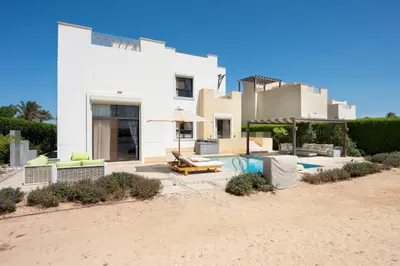 a house on the beach with a pool at VESTA - El Gouna Residence in Hurghada
