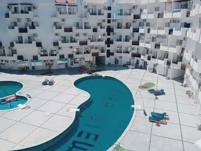 an aerial view of a building with a swimming pool at Tiba view in Hurghada