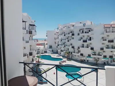 a balcony with a view of a building at Tiba view in Hurghada