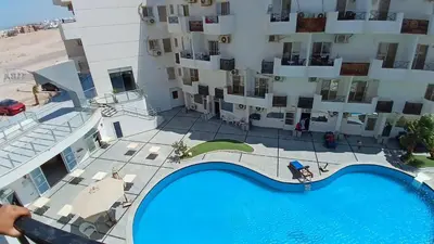 an overhead view of a building with a swimming pool at Tiba view in Hurghada