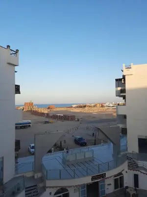 an aerial view of a parking lot and the ocean at Tiba view in Hurghada
