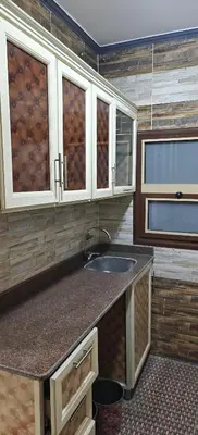 a kitchen with a sink and a counter top at THE Nile Diamond Guest House in Luxor