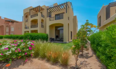 a large house with flowers in front of it at Luxury Stays in Tawila El Gouna in Hurghada
