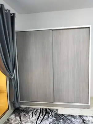 a sliding glass door in a room with a curtain at Luxury apartment with beautiful view and free private beach in Hurghada
