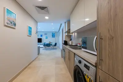 a kitchen with a sink and a dishwasher at Special apartment with Pool and Seasideview, El Gouna in Hurghada